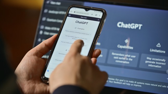 Seoul, South Korea - February 12, 2023 : Computer screen with ChatGPT website and person using mobile phone to ask questions to ChatGPT; Shutterstock ID 2400648421; purchase_order: -; job: -; client: -; other: -