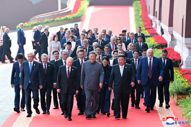 This picture taken on September 3, 2025 and released from North Korea's official Korean Central News Agency (KCNA) on September 4, 2025 shows (front L-R) Russia's President Vladimir Putin, China's President Xi Jinping and North Korean leader Kim Jong Un arriving to a military parade marking the 80th anniversary of victory over Japan and the end of World War II, in Beijing's Tiananmen Square. (Photo by KCNA VIA KNS / AFP) / South Korea OUT / ---EDITORS NOTE--- RESTRICTED TO EDITORIAL USE - MANDATORY CREDIT "AFP PHOTO/KCNA VIA KNS" - NO MARKETING NO ADVERTISING CAMPAIGNS - DISTRIBUTED AS A SERVICE TO CLIENTS / THIS PICTURE WAS MADE AVAILABLE BY A THIRD PARTY. AFP CAN NOT INDEPENDENTLY VERIFY THE AUTHENTICITY, LOCATION, DATE AND CONTENT OF THIS IMAGE --- / (Photo by STR/KCNA VIA KNS/AFP via Getty Images)