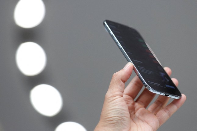 A person holds an iPhone air during Apple's event