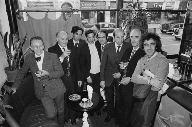 Former hostages return to the Spaghetti House restaurant in Knightsbridge, London, 8th October 1975. The men, all staff at the restaurant, were held hostage for six days in September 1975 by armed robbers claiming to belong to the Black Liberation Front. (Photo by John Downing/Hulton Archive/Getty Images)