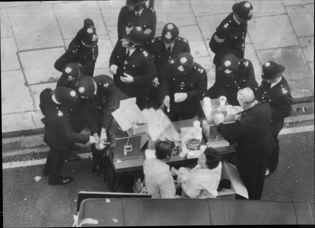 Mandatory Credit: Photo by Monty Fresco/ANL/Shutterstock (1671393a) The Spaghetti House Siege Knightsbridge London - 1975 - A Mobile Canteen Serves Tea To Police. The Spaghetti House Siege Knightsbridge London - 1975 - A Mobile Canteen Serves Tea To Police.