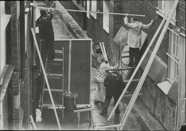 Mandatory Credit: Photo by Bill Cross/ANL/Shutterstock (1669811a) The Spaghetti House Siege Knightbridge London - 1975 - A Barricade Built Behind The Spaghetti House. The Spaghetti House Siege Knightbridge London - 1975 - A Barricade Built Behind The Spaghetti House.